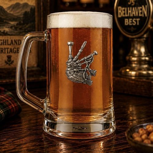 A Beer Tankard with a Pewter Bagpipes badge on the front, filled with Amber Beer