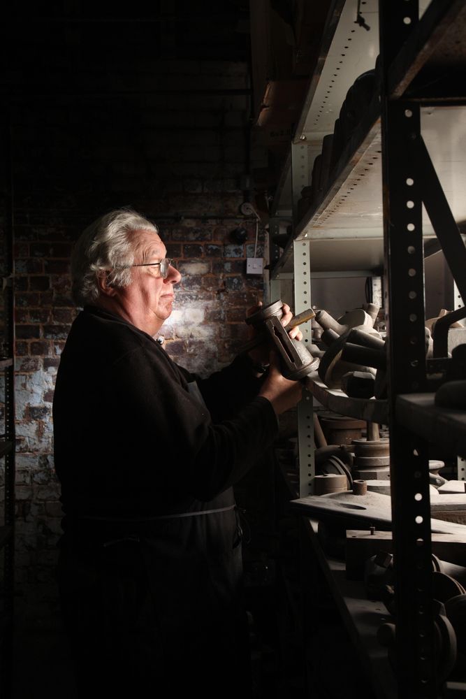 A Pewter Maker picking up an Antique Mould