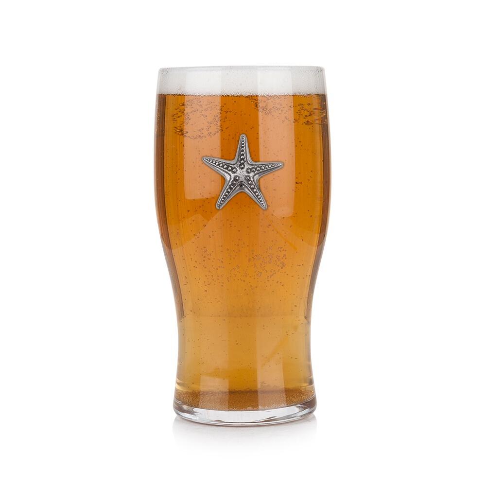 Pint glass with handmade pewter starfish badge, filled with golden beer