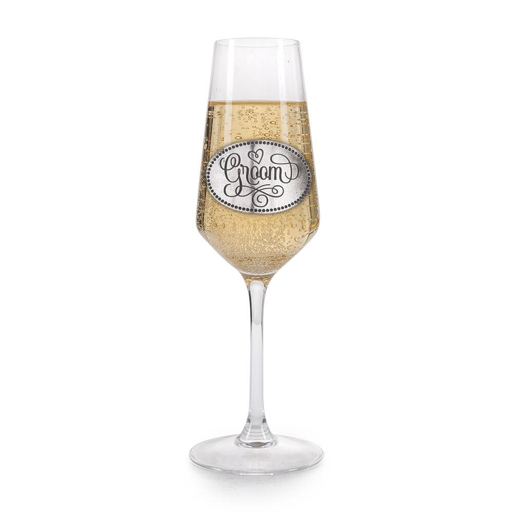 A Champagne Flute with a Pewter Groom badge on the front, filled with Champagne