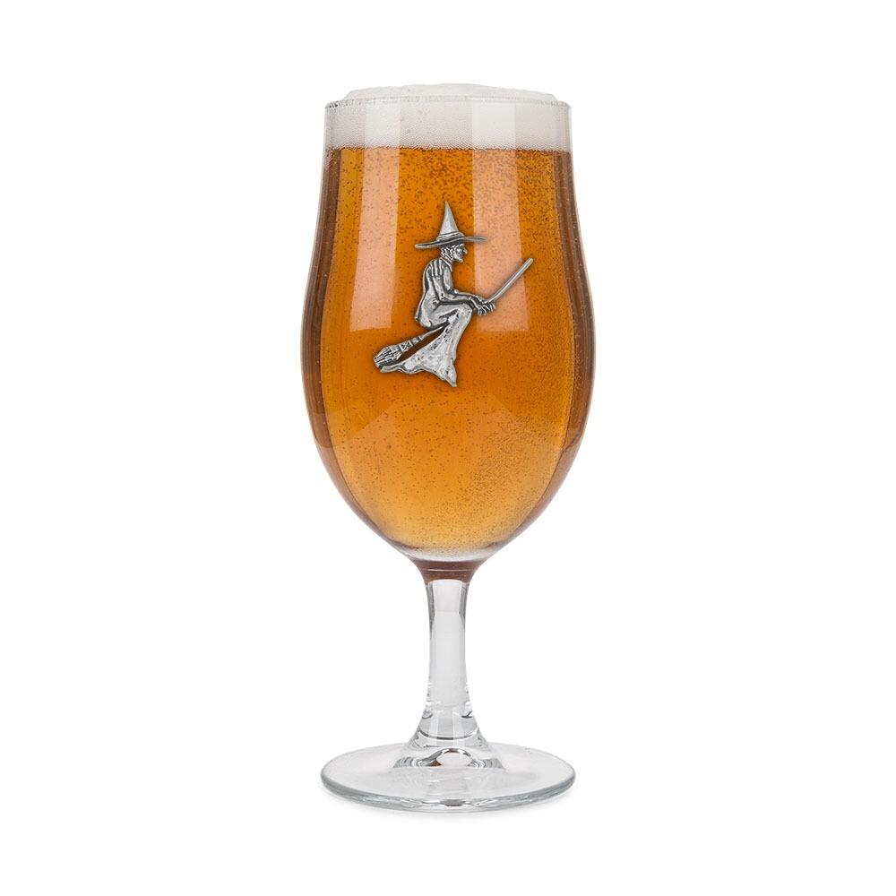 A Stemmed Pint Beer Glass with a Pewter Witch badge on the front, filled with Beer