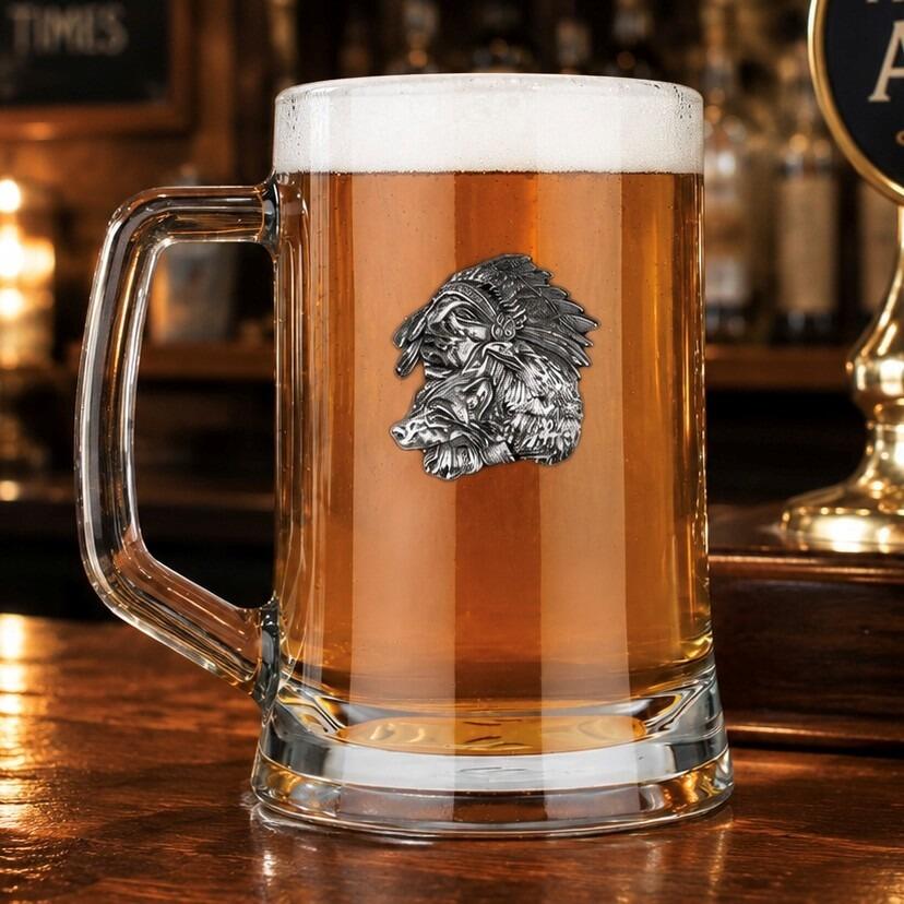 A Beer Tankard with a Pewter Native badge on the front, filled with Amber Beer