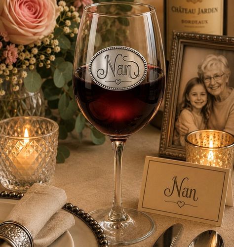 Wine glass with handcrafted pewter Nan badge filled with red wine