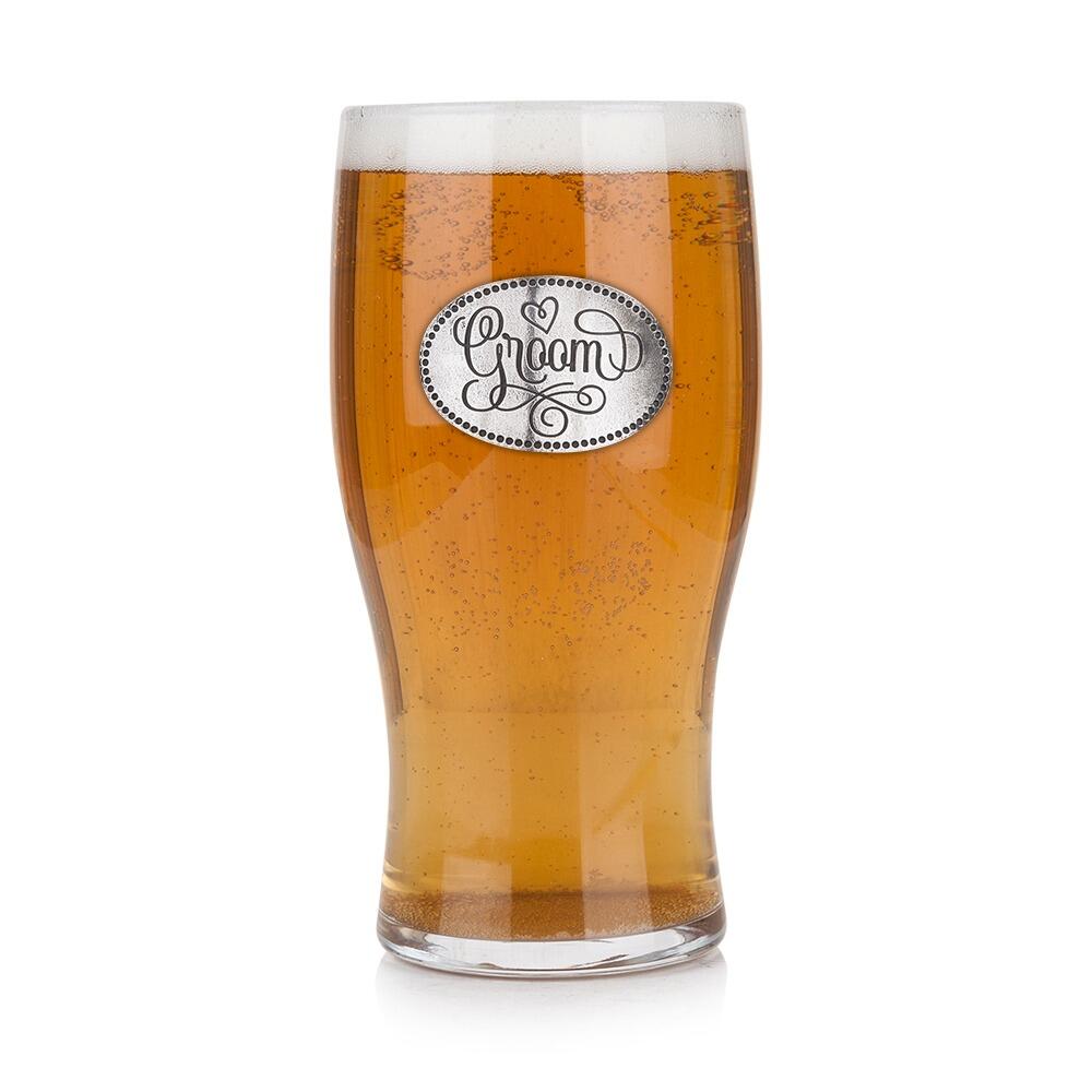 Pint glass with handmade pewter groom in formal attire badge filled with golden beerRetryClaude can make mistakes. Please double-check responses.