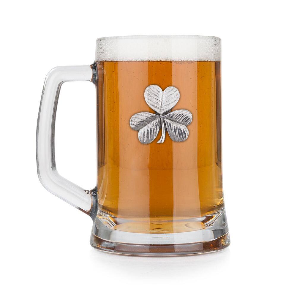 A Beer Tankard with a Pewter Shamrock badge on the front, filled with Amber BeerRetryClaude can make mistakes. Please double-check responses.