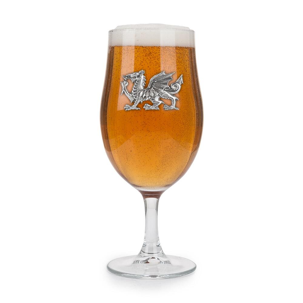 A Stemmed Pint Beer Glass with a Pewter Welsh Dragon badge on the front, filled with Beer