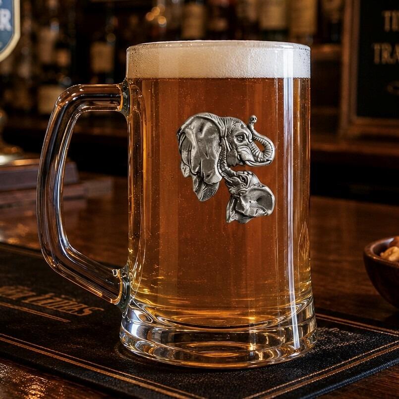 A Beer Tankard with a Pewter Elephant badge on the front, filled with Amber Beer