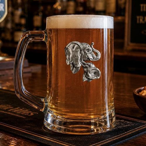 A Beer Tankard with a Pewter Elephant badge on the front, filled with Amber Beer