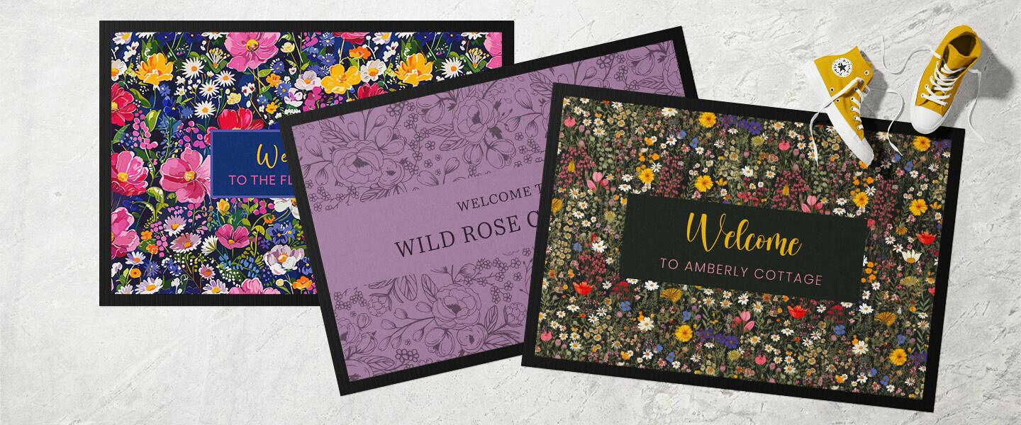 Three floral doormats
