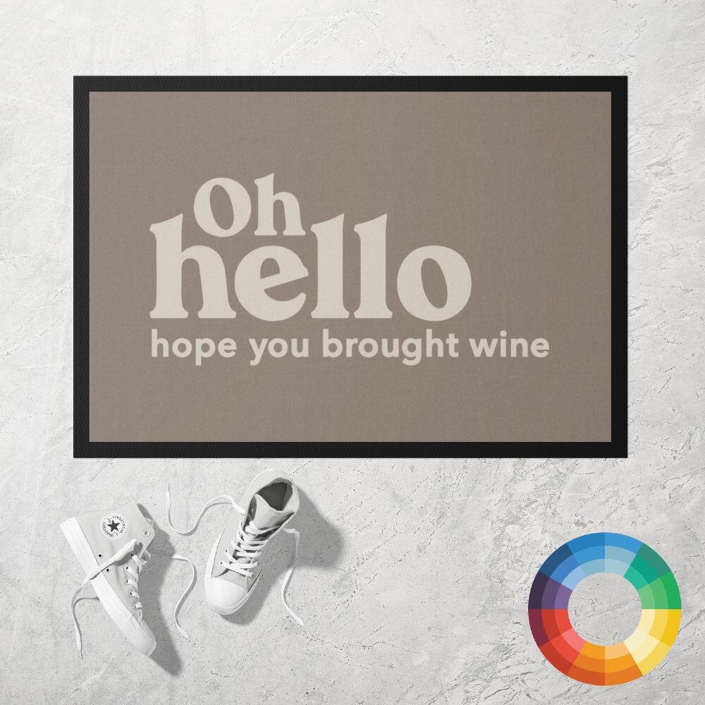 OH HELLO HOPE YOU BROUGHT WINE Doormat in brown