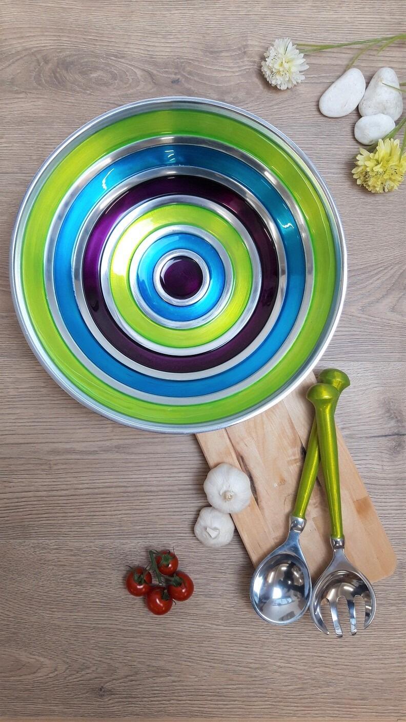 Multicoloured round salad bowl and servers