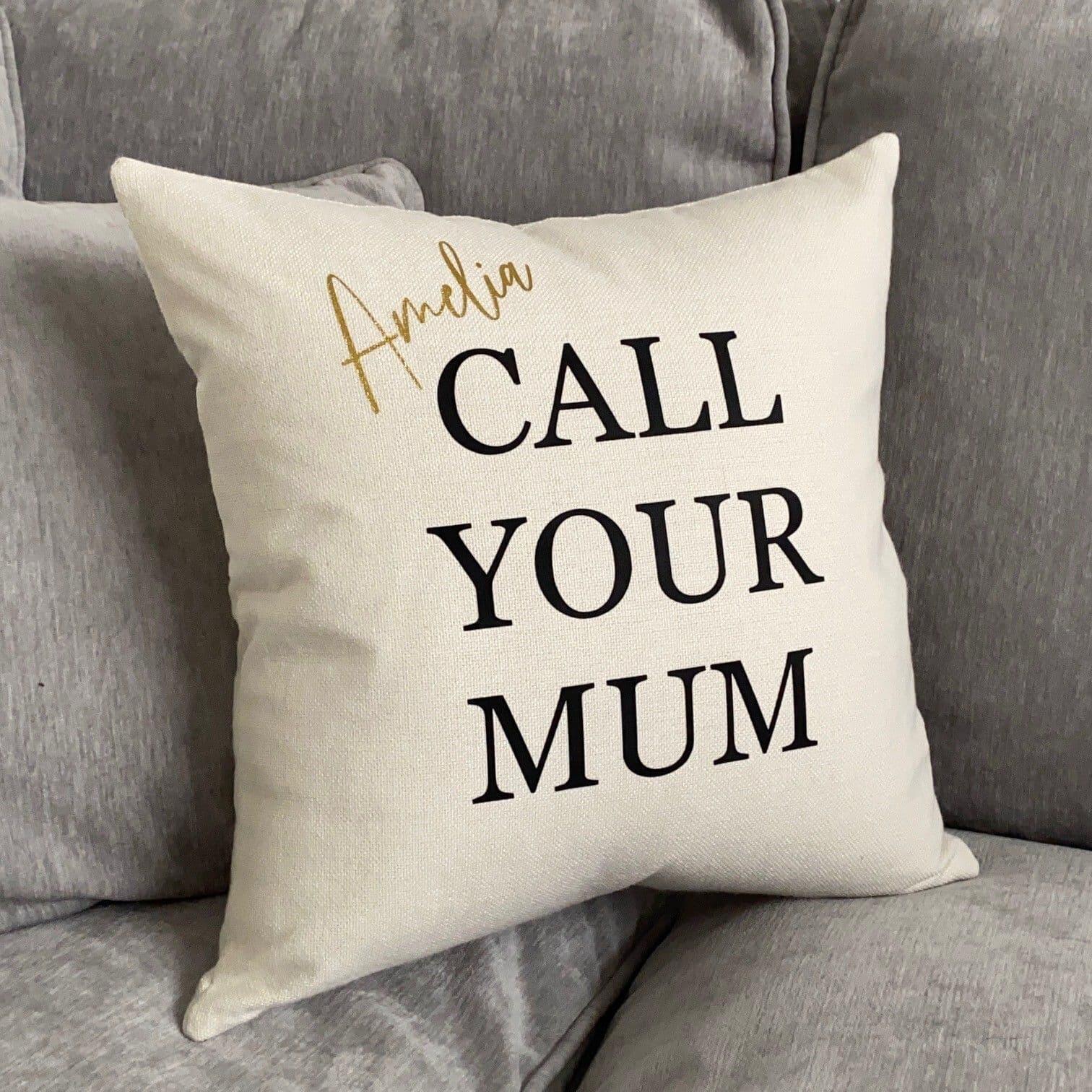 Cream cushion with black writing says call your parents