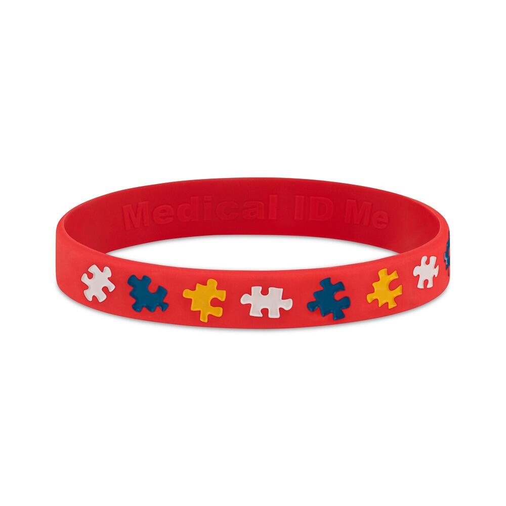 Red I Have ADHD bracelet with puzzle piece icons