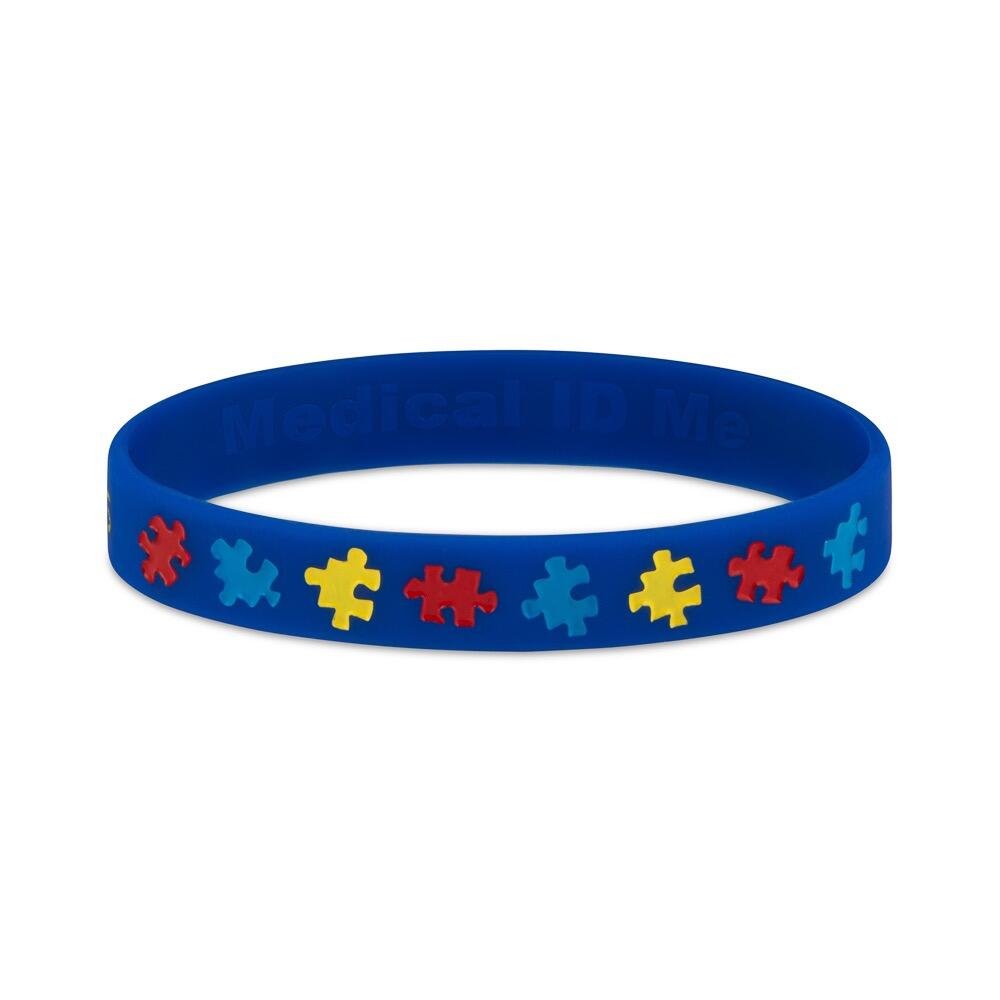 Blue ADHD awareness marks bracelet with multicolour puzzle piece icons