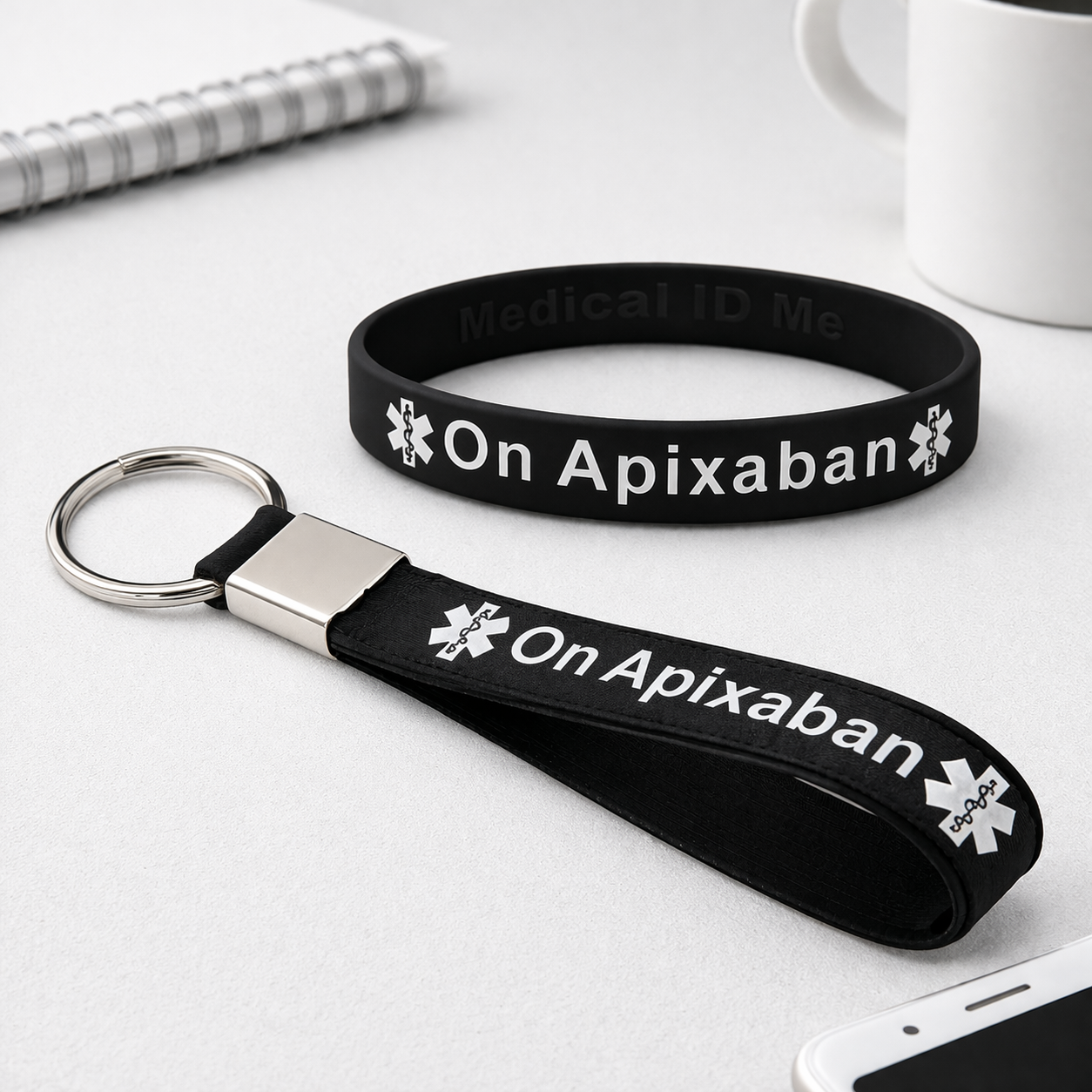 On Apixaban Black Wristband and Keyring Set