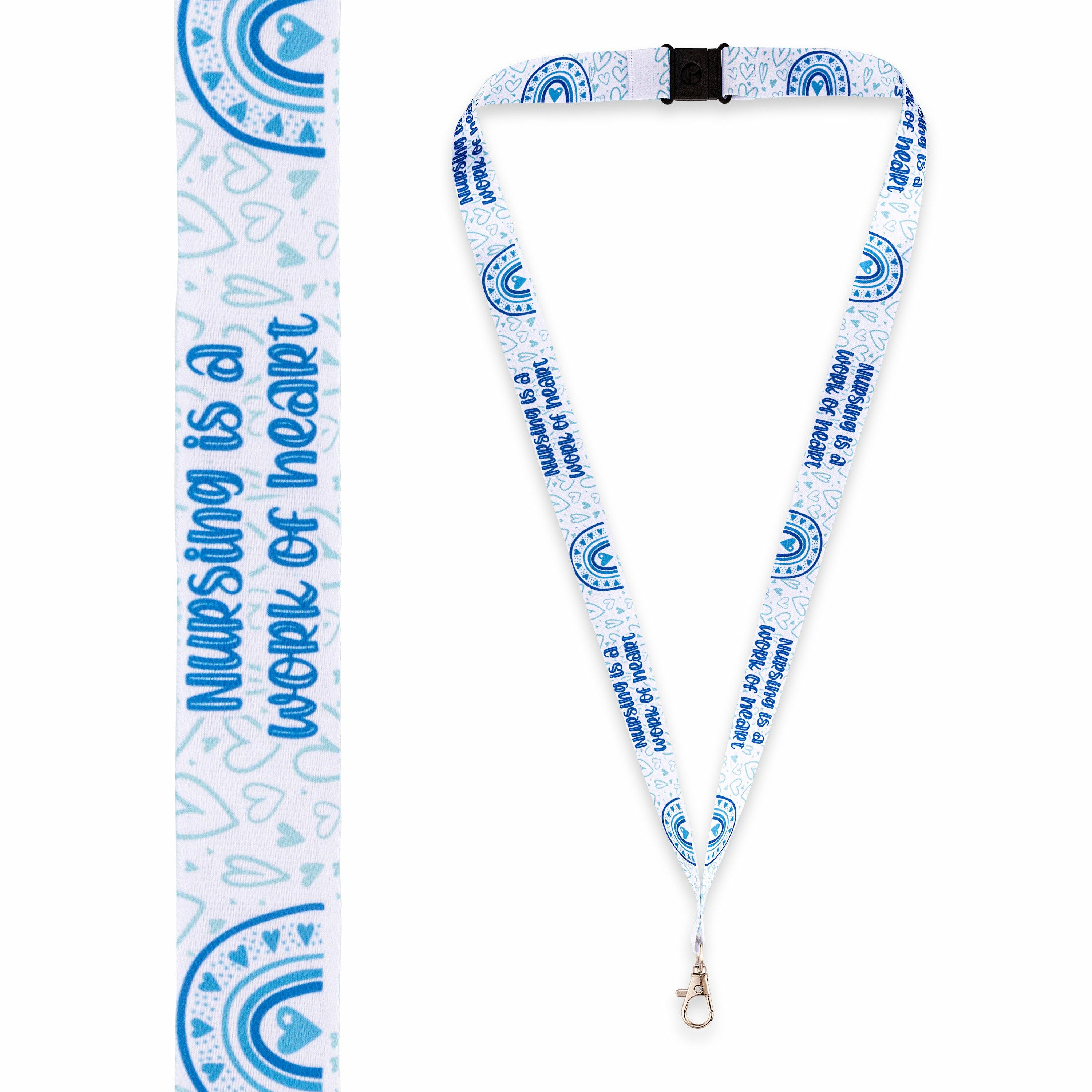 Light blue “Nursing Is a Work of Heart” lanyard displayed flat with printed text and breakaway clasp