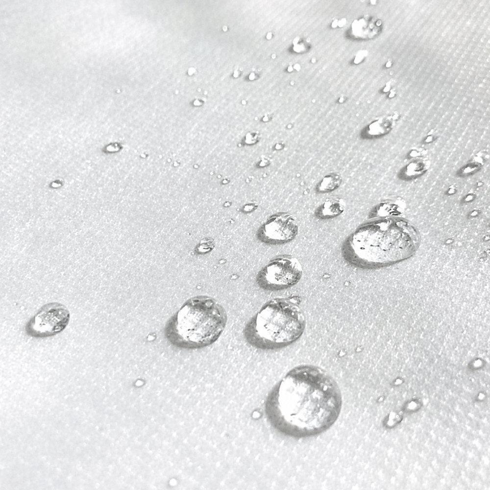 Water-resistant outdoor cushion insert with raindrops on fabric