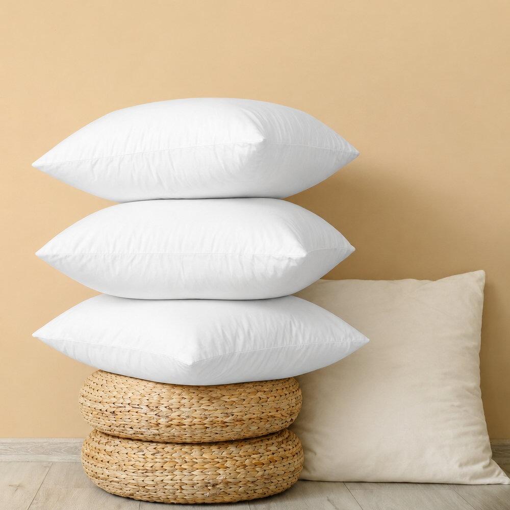 White floor cushion inserts stacked together