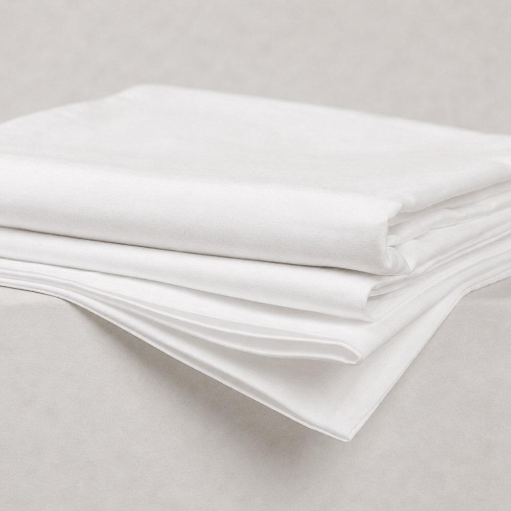 Folded white standard pillowcases showing soft fabric folds