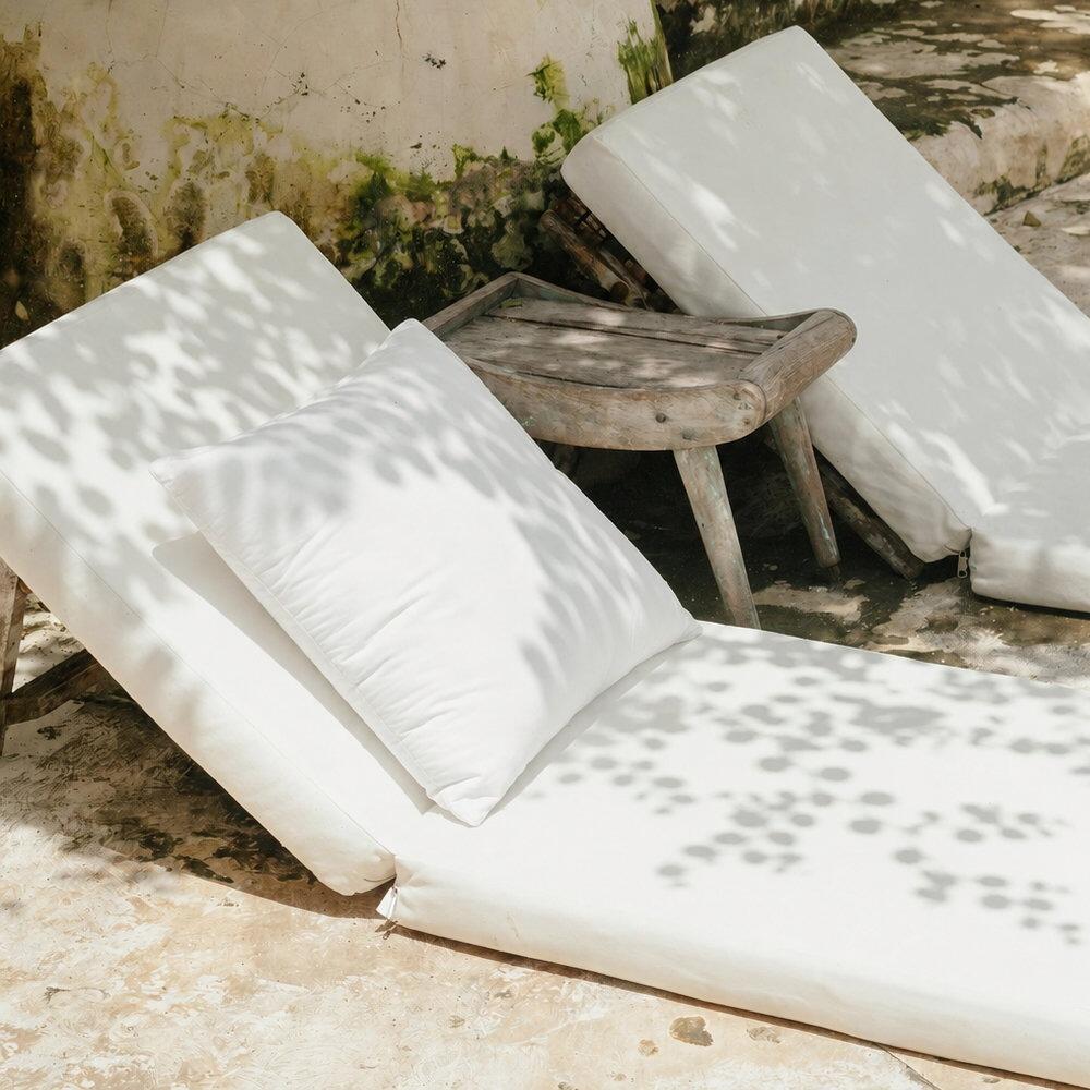 Outdoor cushion pads styled on outdoor loungers