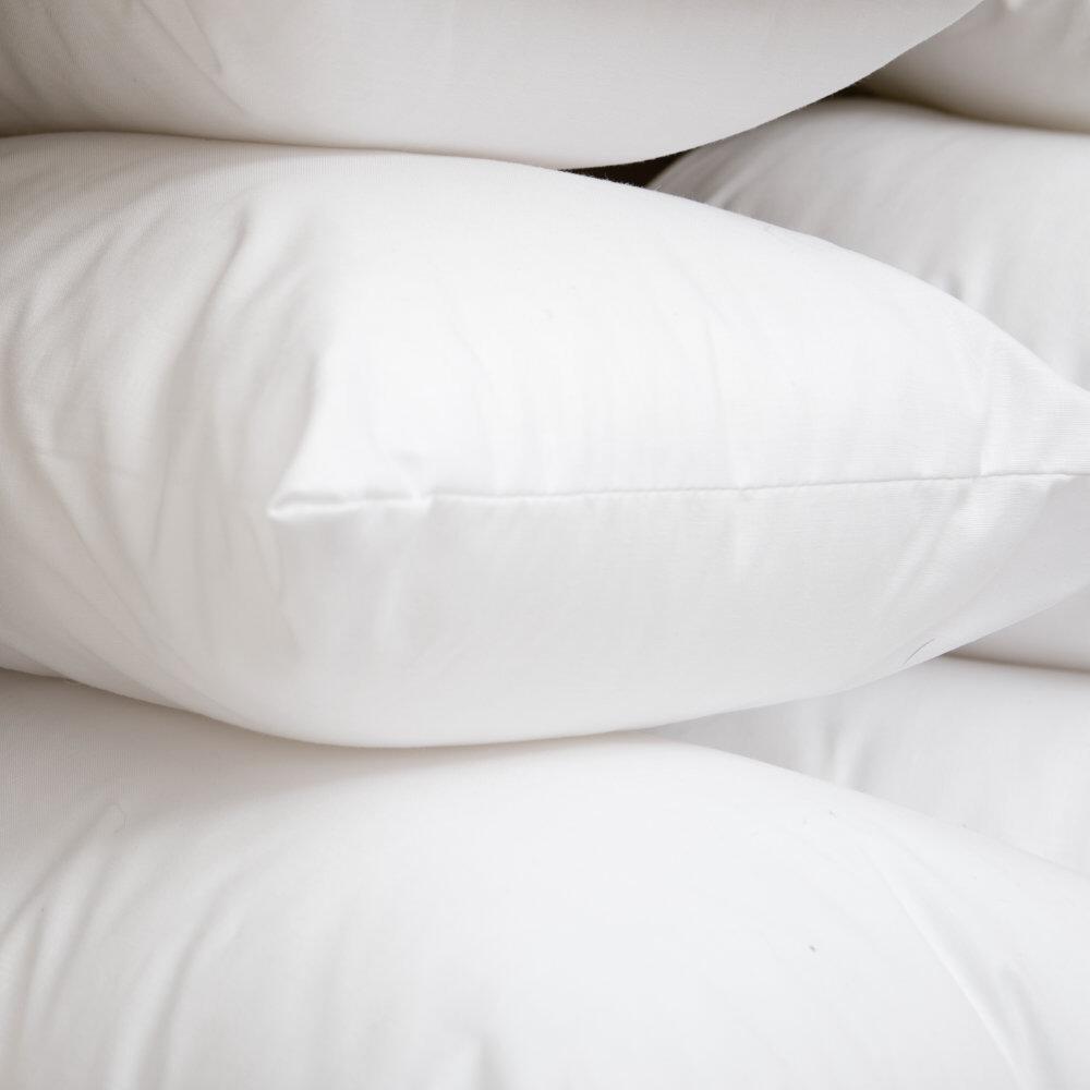 Close-up of rectangle fibre cushion pads stacked together