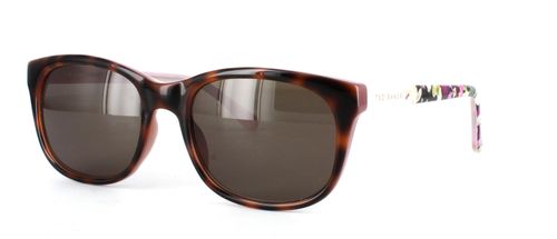 Women's tortoise oval shaped acetate prescription sunglasses frame with barrel hinge temples leading to flower patterned acetate arms - image view 1