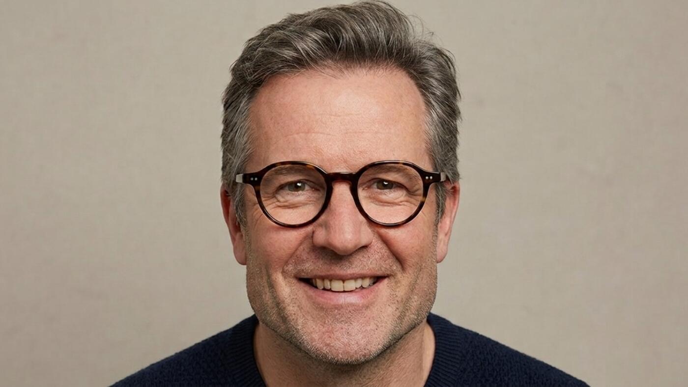 man with square shaped face wearing glasses