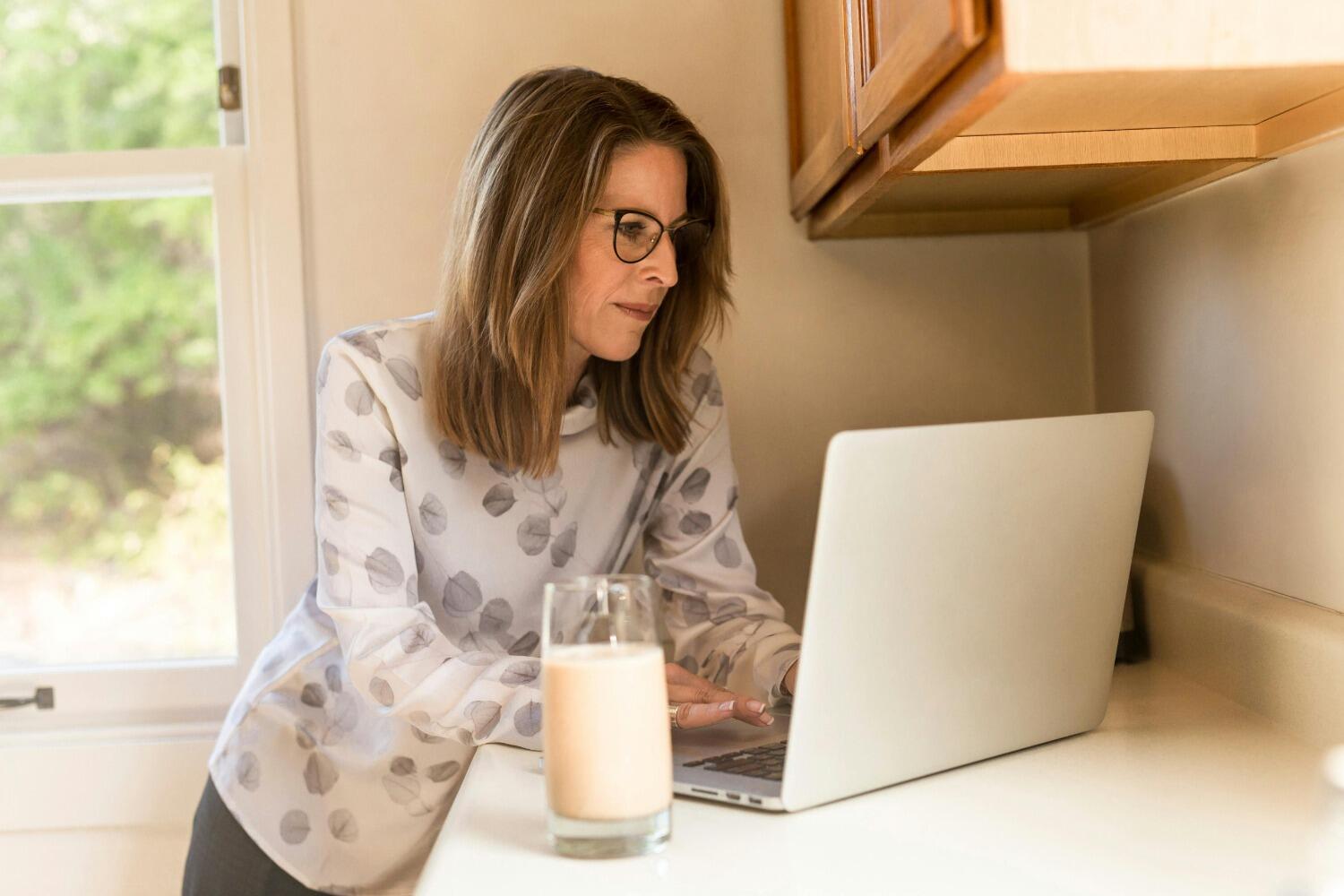 Lady wearing glasses using laptop
