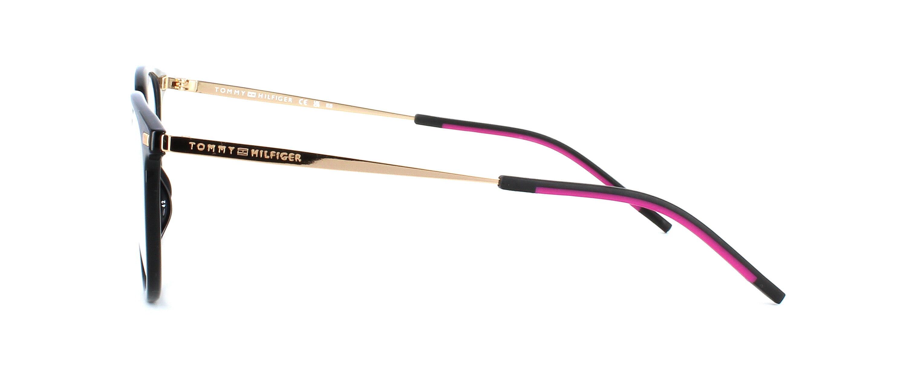 Round shaped polyamide and stainless steel women's glasses in black with gold arms and rubber ear tips - image view 2