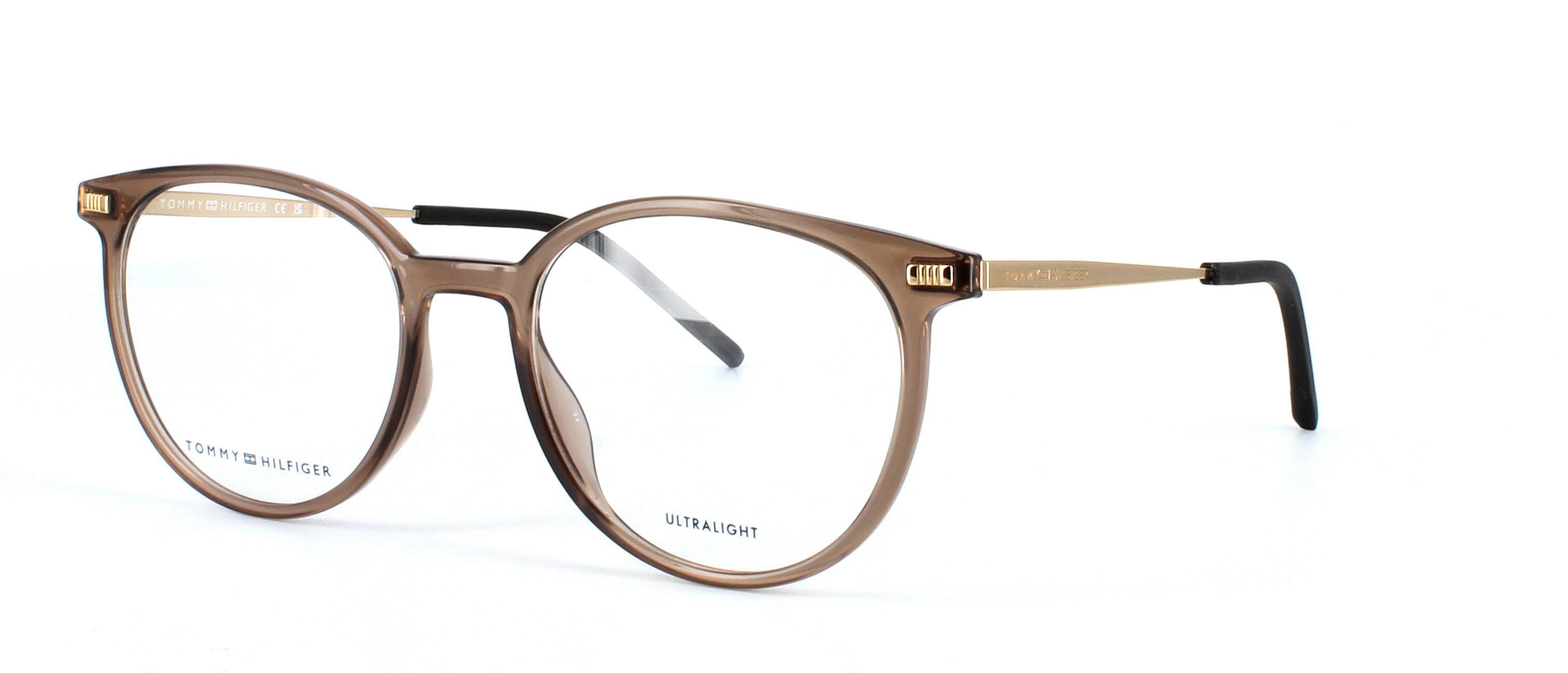 Round shaped polyamide and stainless steel women's glasses in crystal brown with gold arms and rubber ear tips - image view 1