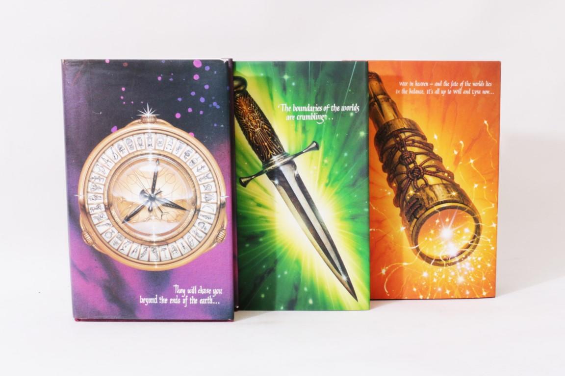Philip Pullman - His Dark Materials Trilogy [comprising] Northern Lights, Subtle Knife & Amber Spyglass - Scholastic, 1995-2000, Signed First Edition.