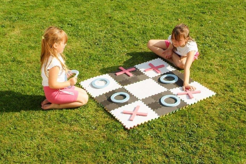 Children playing noughts and crosses