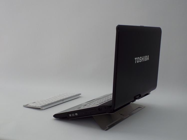 Rear view of a Laptop on Shadow laptop stand at it's lowest position with keyboard in front
