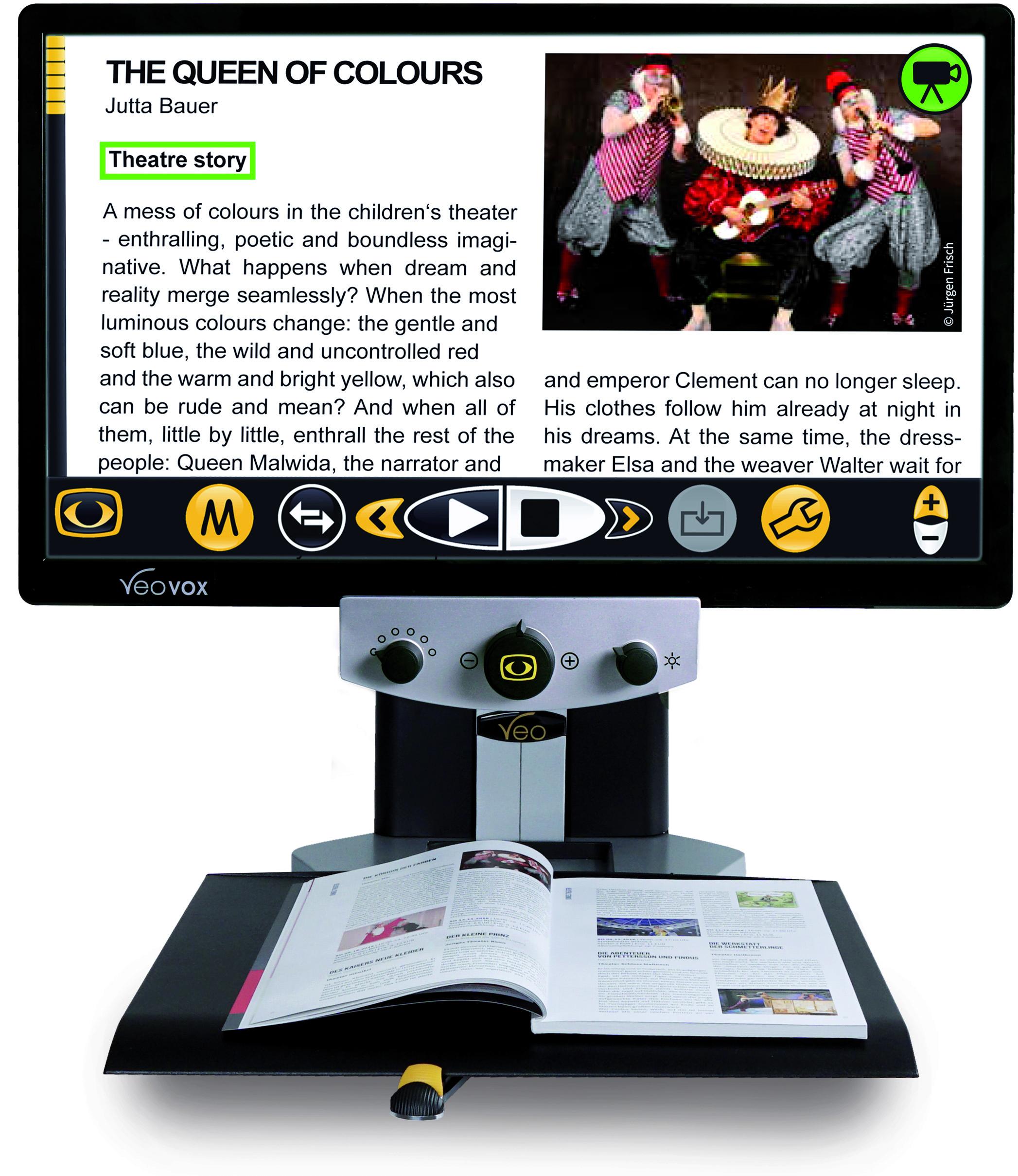 VEO Vox desktop magnifier with speech displaying magazine page on the 24" screen