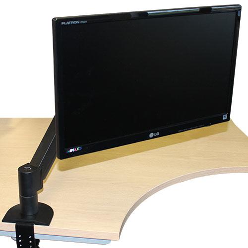 Monitor connected to a desk with a monitor arm