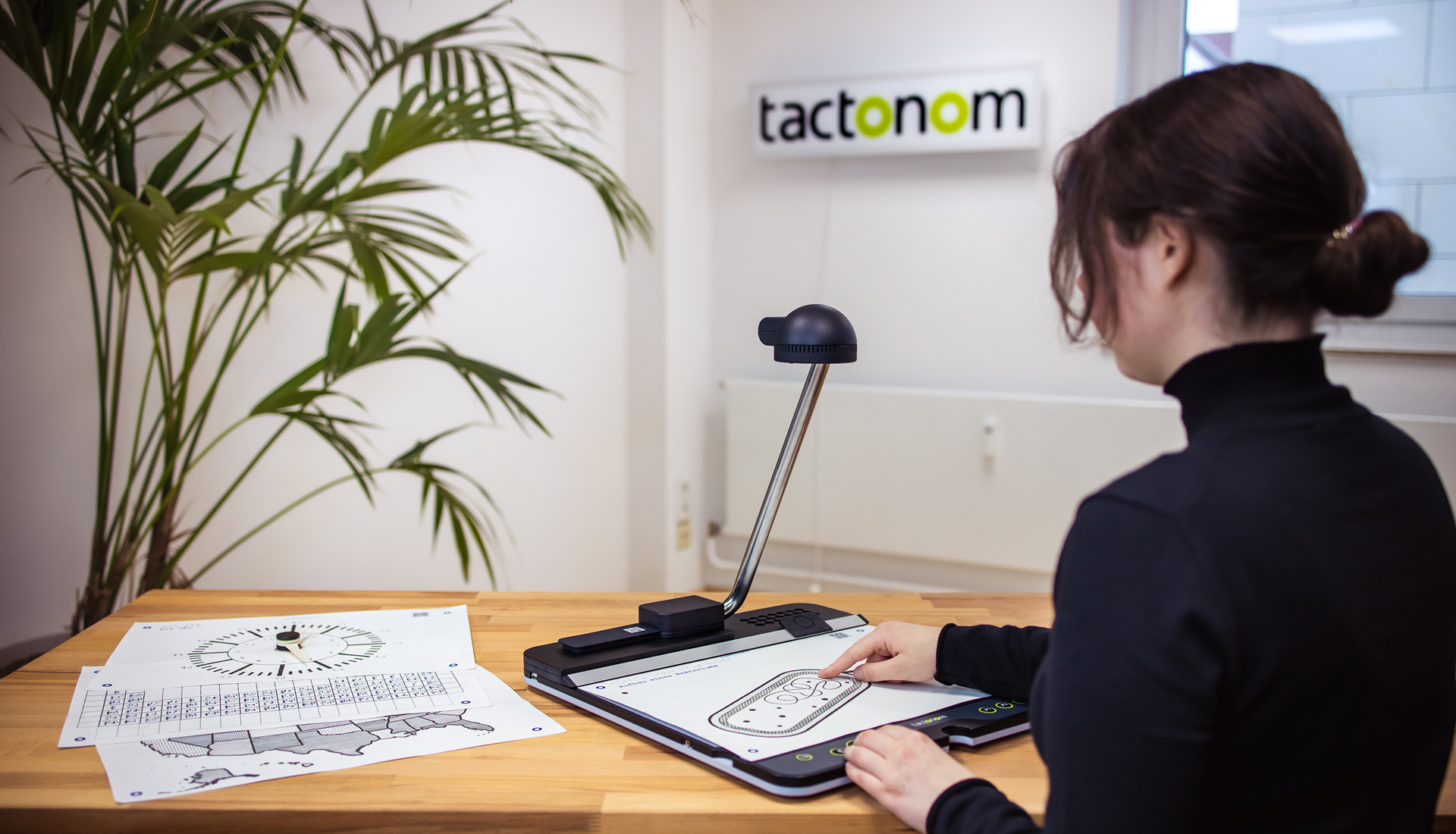 a lady using the Tactonom Reader