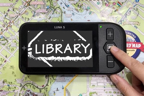 Luna S in White on Black mode the Luna S is placed on a map and the user is looking at the location of the Library.