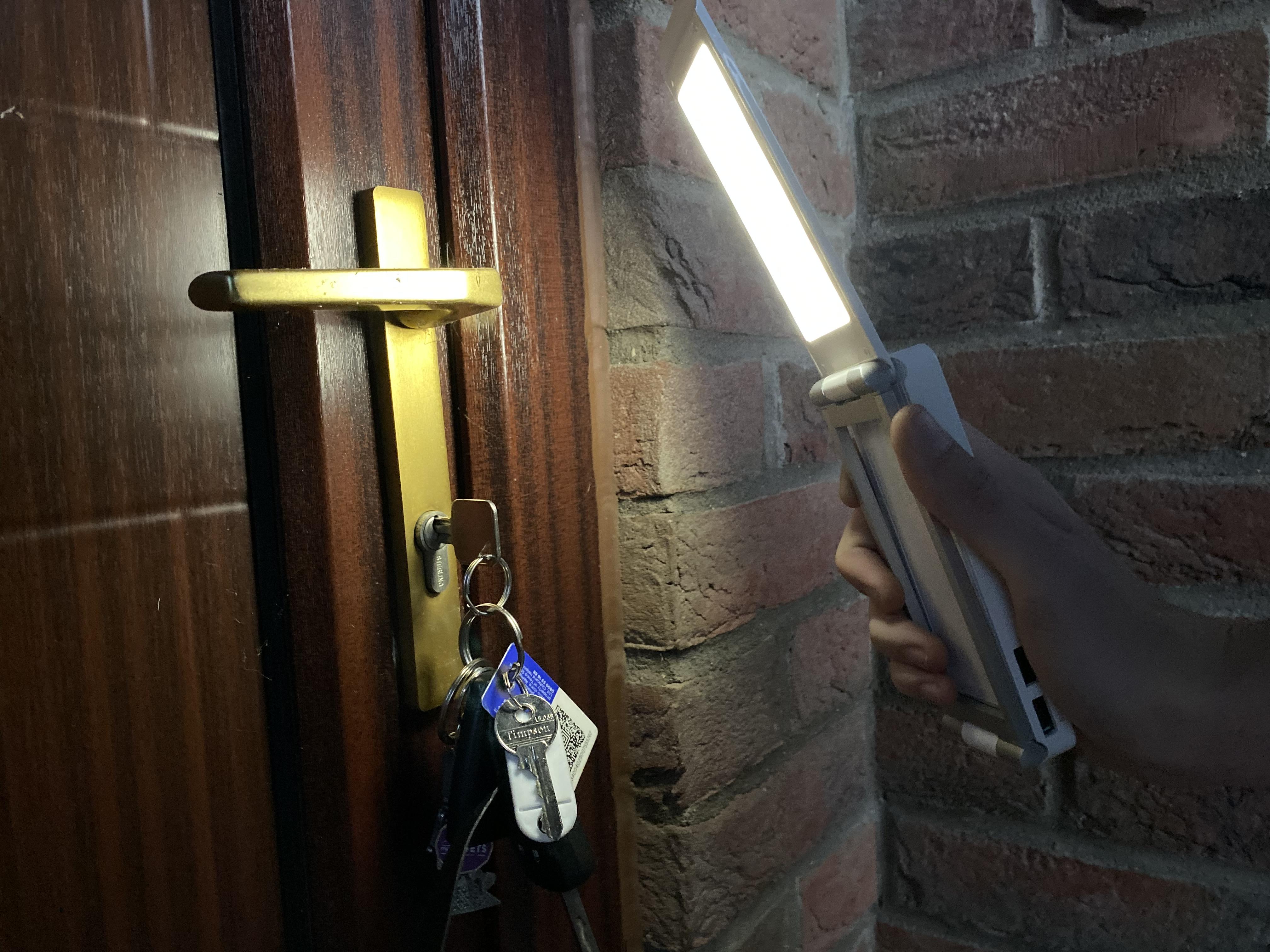 TravelBright 3 being used to light a door lock