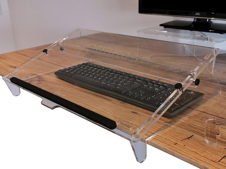 Copywriter Document Holder sat on a desk pulled over a keyboard, there is alos a monitor on the desk