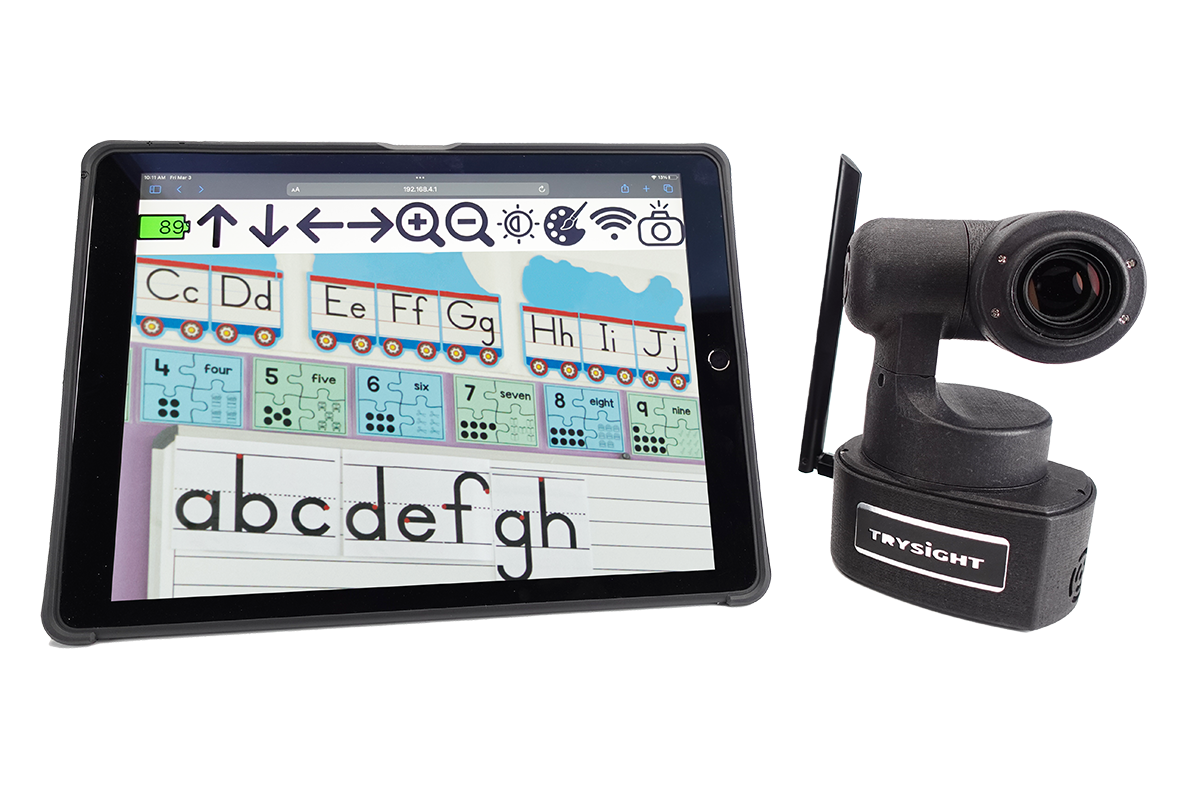 Magnibot next to an ipad , on the screen you can see some letters of the alphabet in order on a classroom wall and some numbers in sequential order also on the classroom wall
