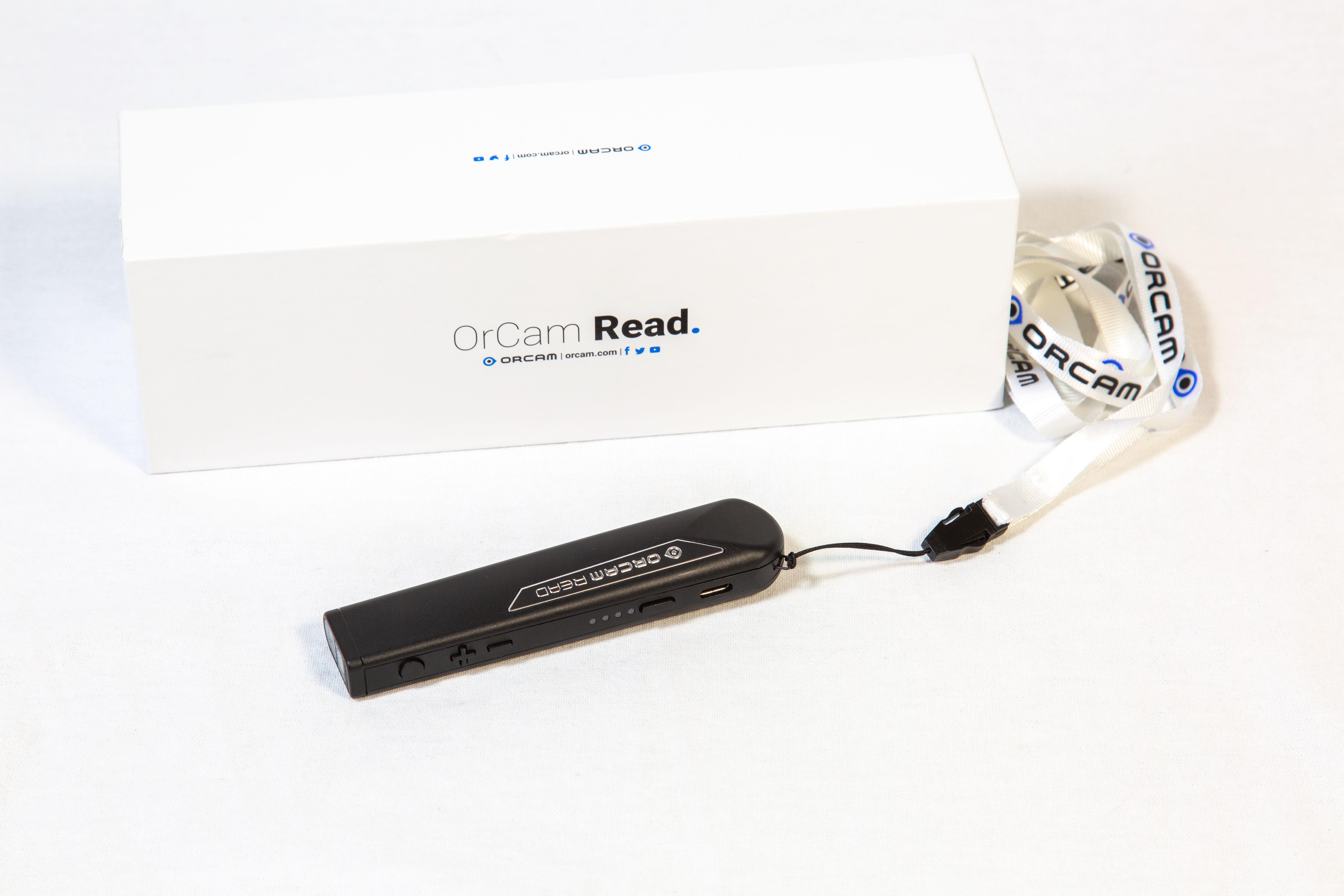 OrCam Read shown next to its box