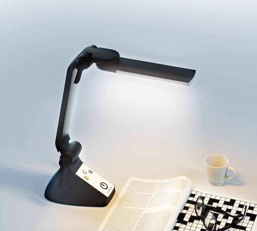 Multilight Pro lighting a crossword puzzle there are a pair of glasses sat on top of the crossword, a white mug is sat on the table too