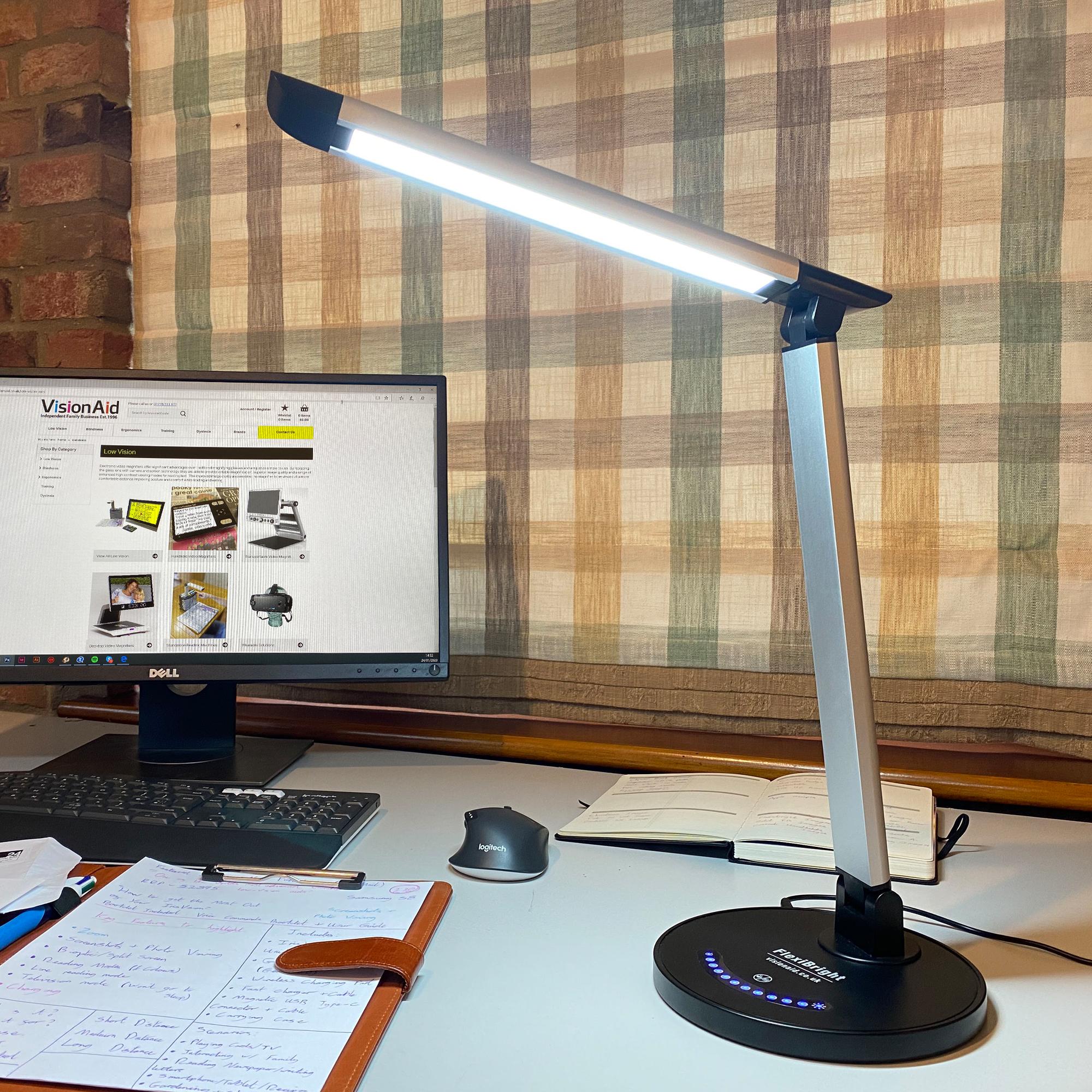 FlexiBright lighting a desk with a computer screen next to it