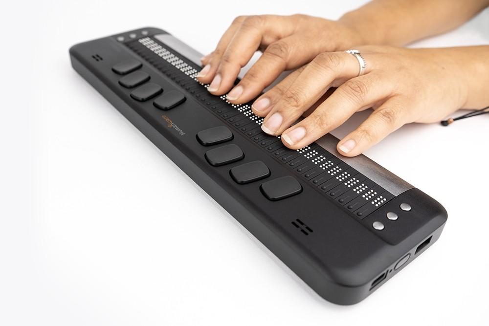 a close up view of the Brailliant BI 40X braille display being used