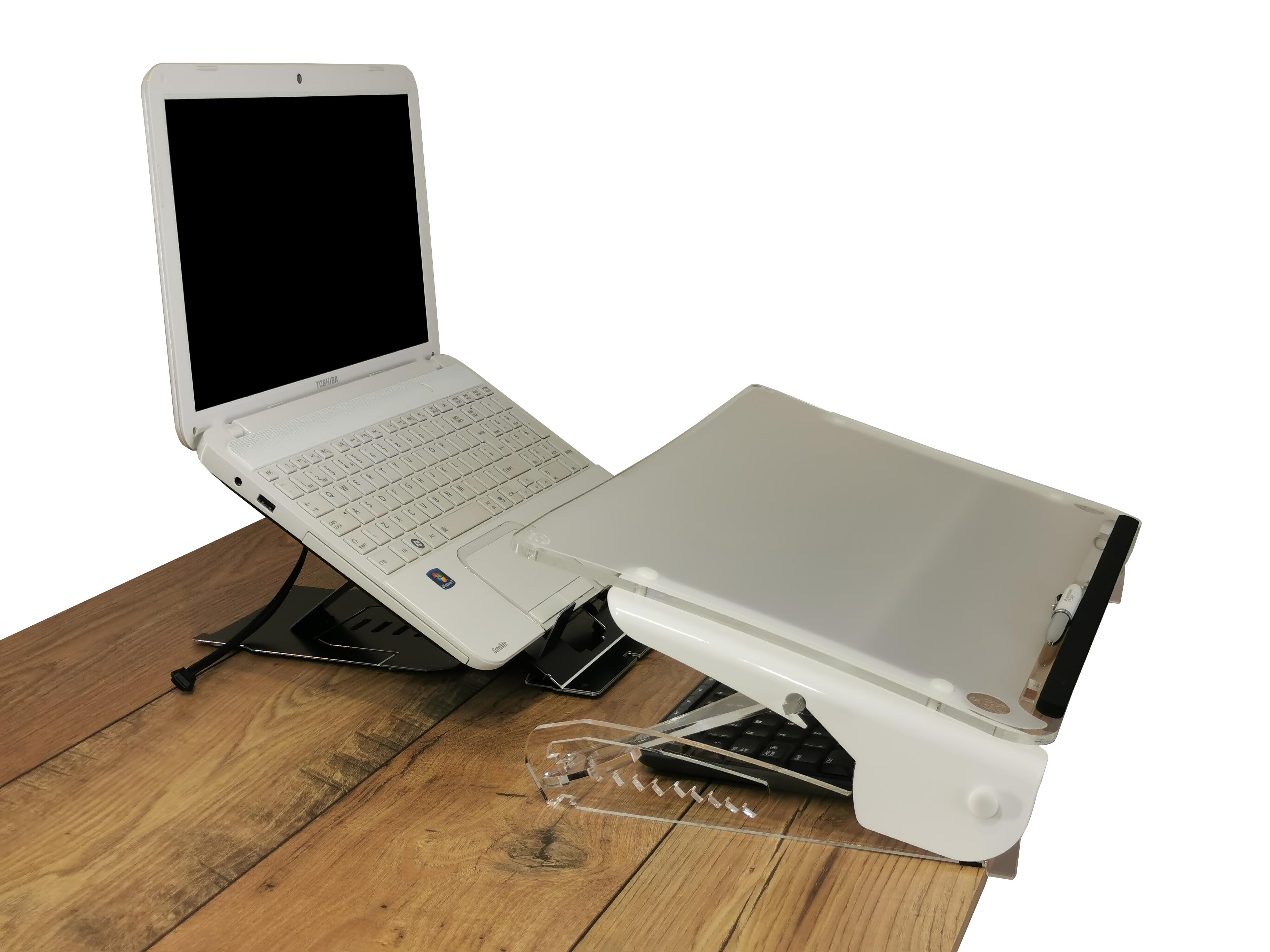 Clear Slope Pro Document Holder on a desk at it's lowest position, there is also a laptop on the desk