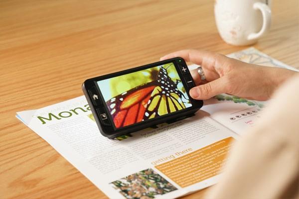 Luna 6 being used to view an image of a monarch butterfly in a magazine