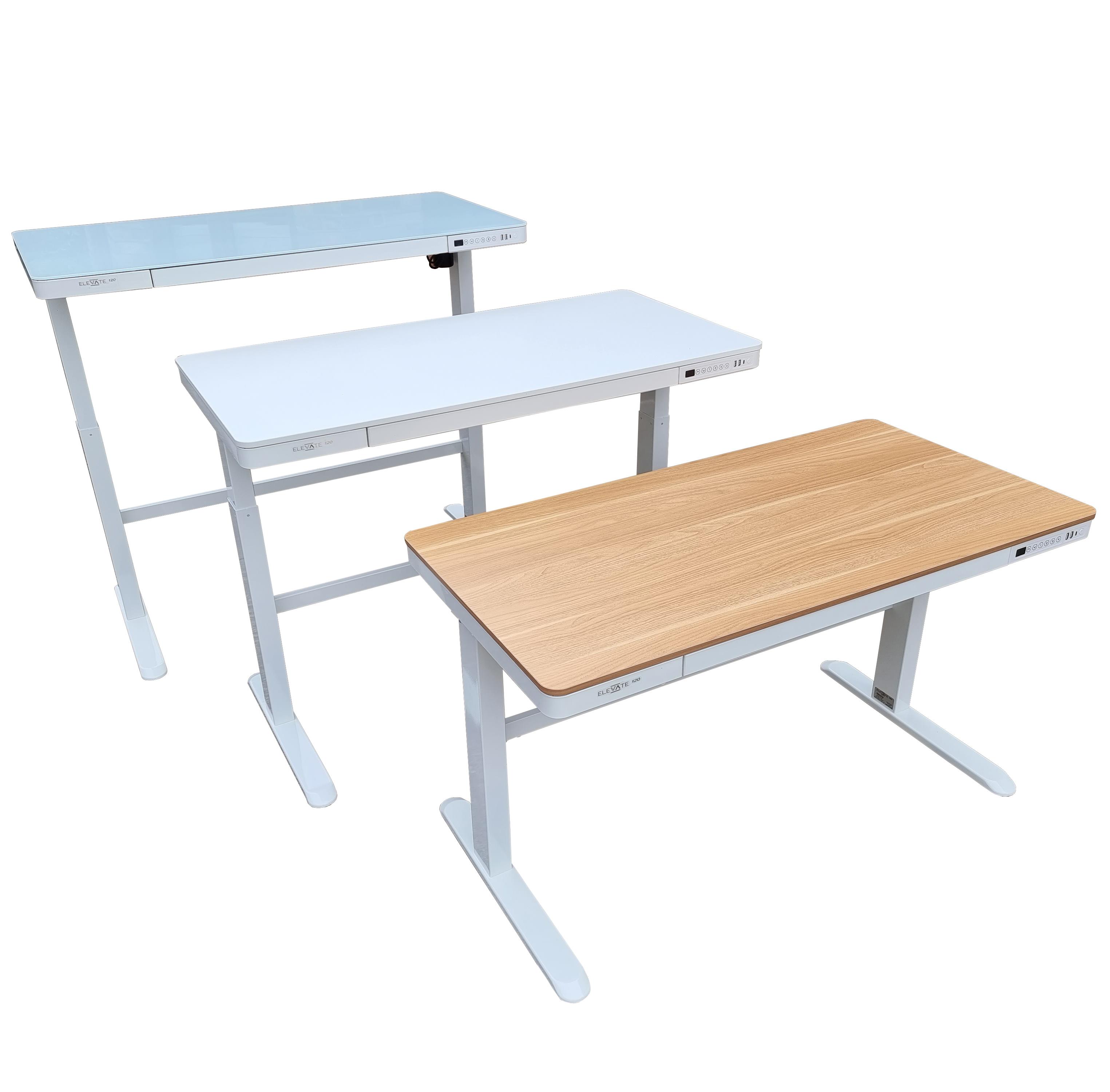 3 Elevate sit stand desks all with white bases, one with a white top, one with an oak top and one with a white glass top