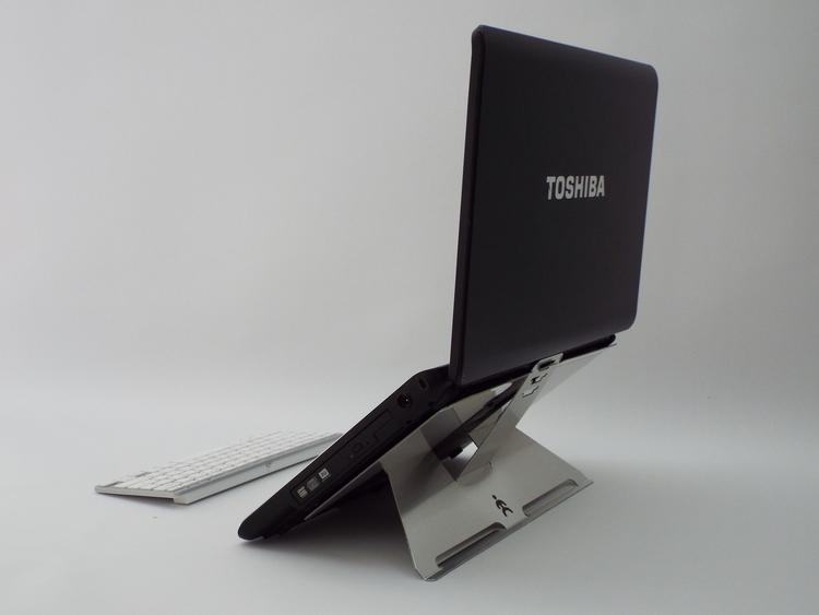 Rear view of a Laptop on Shadow laptop stand at it's highest position with keyboard in front