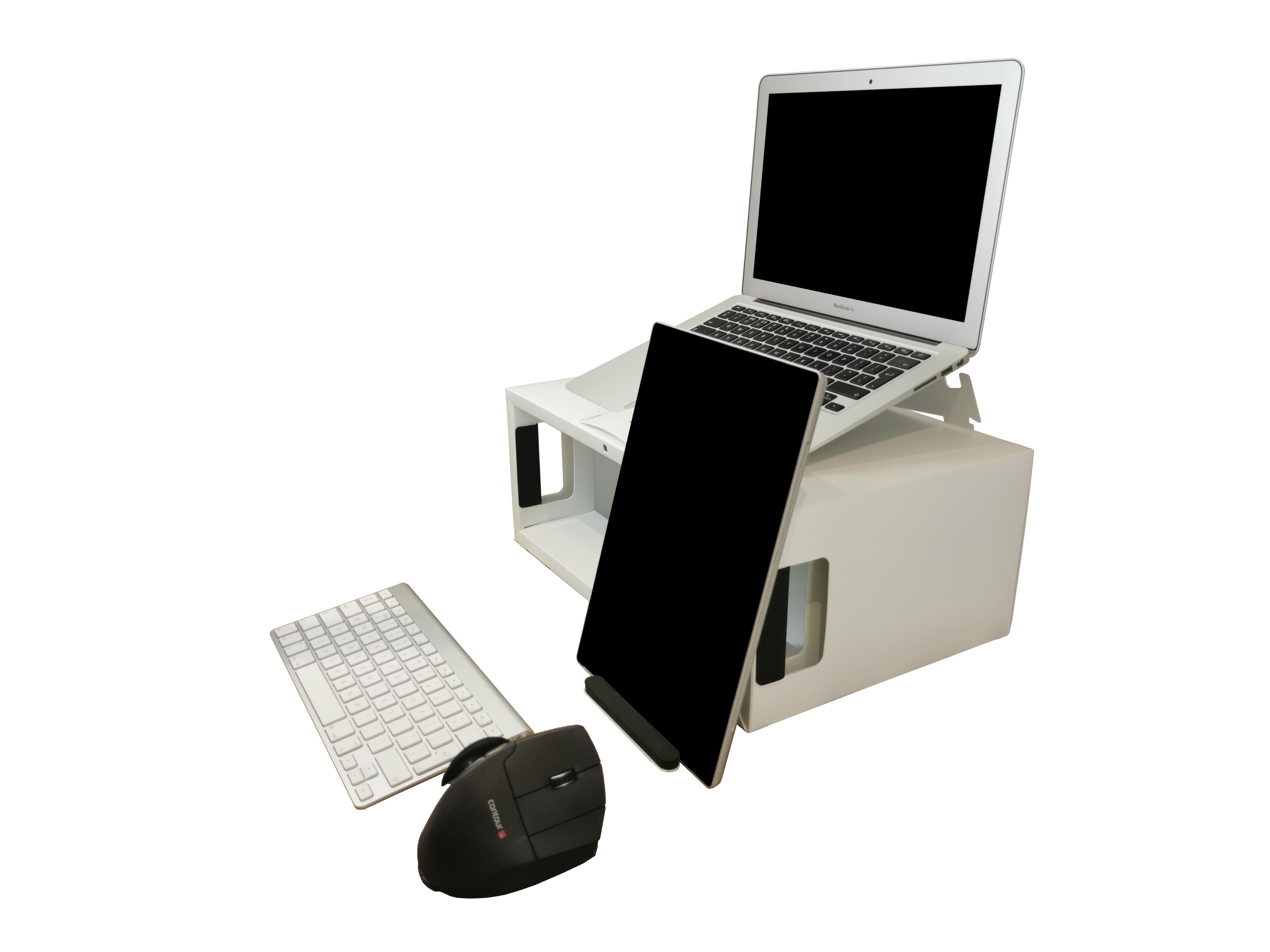 Box office pro set up with a laptop sat on top of the box office pro a tablet propped against the tablet stand theres a wireless keyboard and mouse sat in front of the box