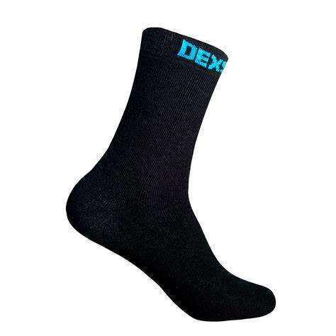 Black sock in a blue cardboard display with blue writing on top of sock